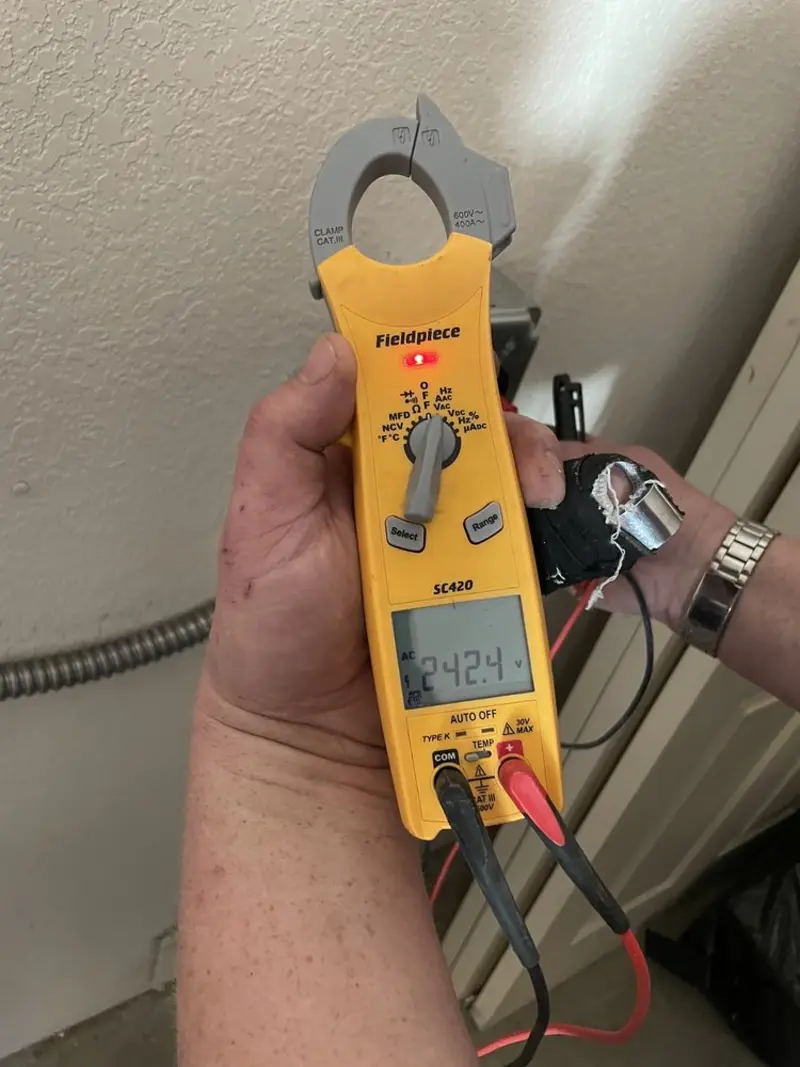 Voltage testing with clamp meter during Ceiling Fan Installation in Mishawaka